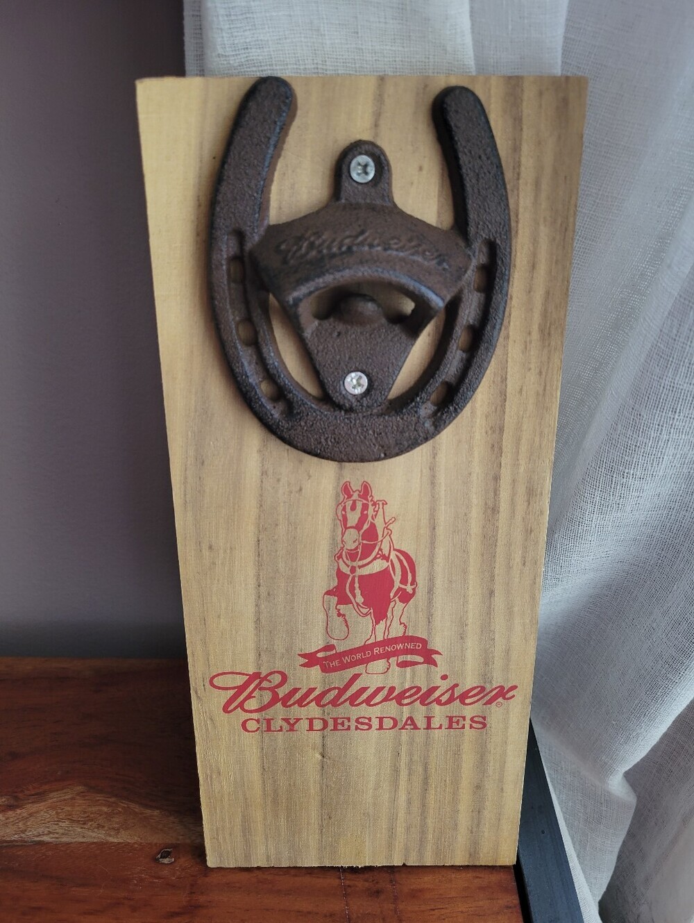 Budweiser Clydesdales wooden wall mounted bottle opener featuring a cast iron